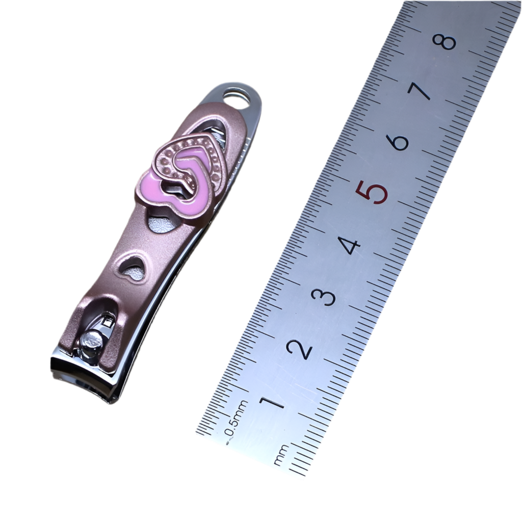 A pair of pink nail clipers with a heart and diamond design.