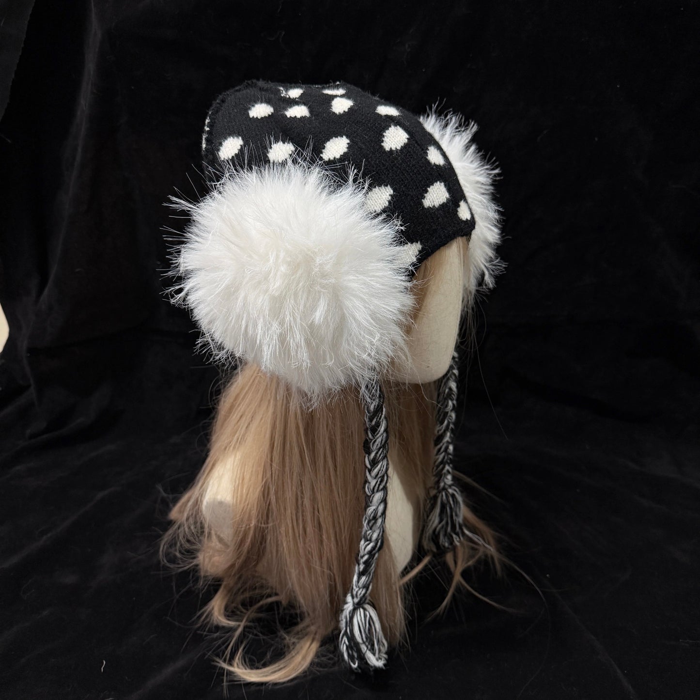Black and white polka dot knit earflap hat with big white fur pom poms y2k aesthetic