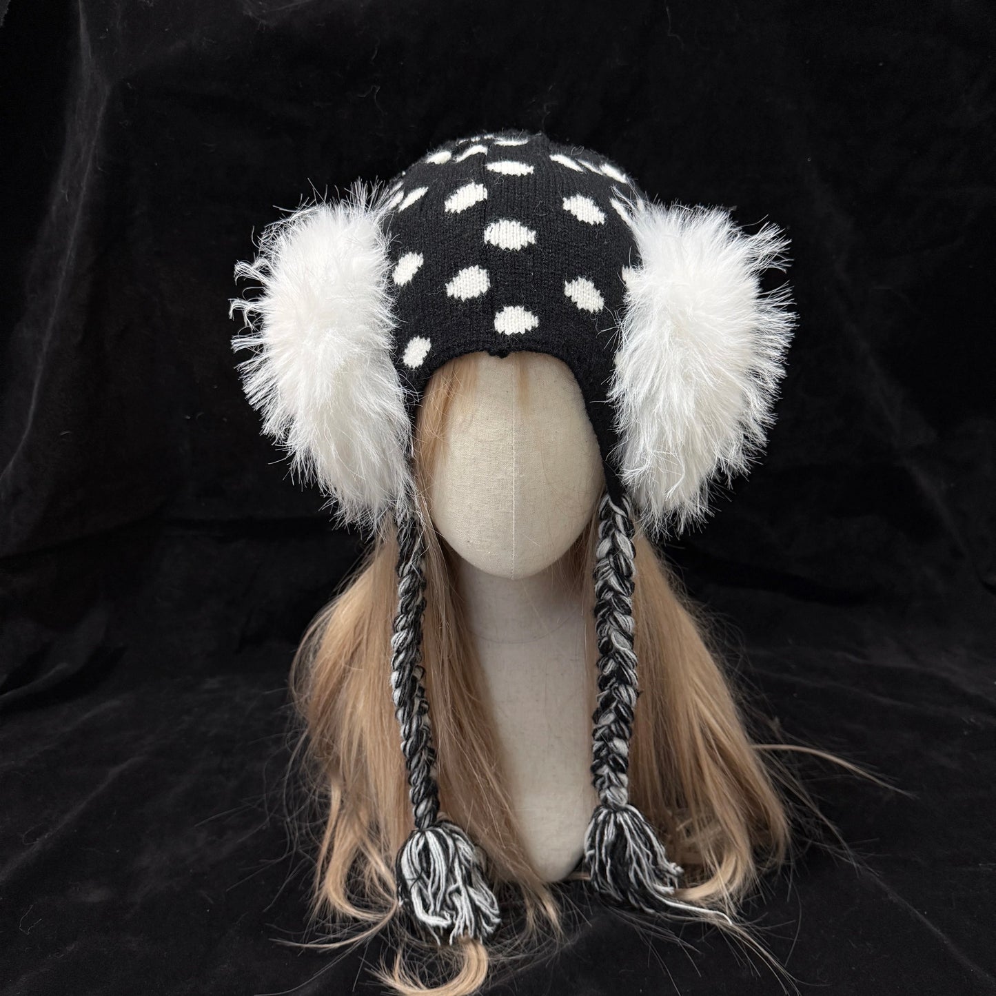 Black and white polka dot knit earflap hat with big white fur pom poms y2k aesthetic