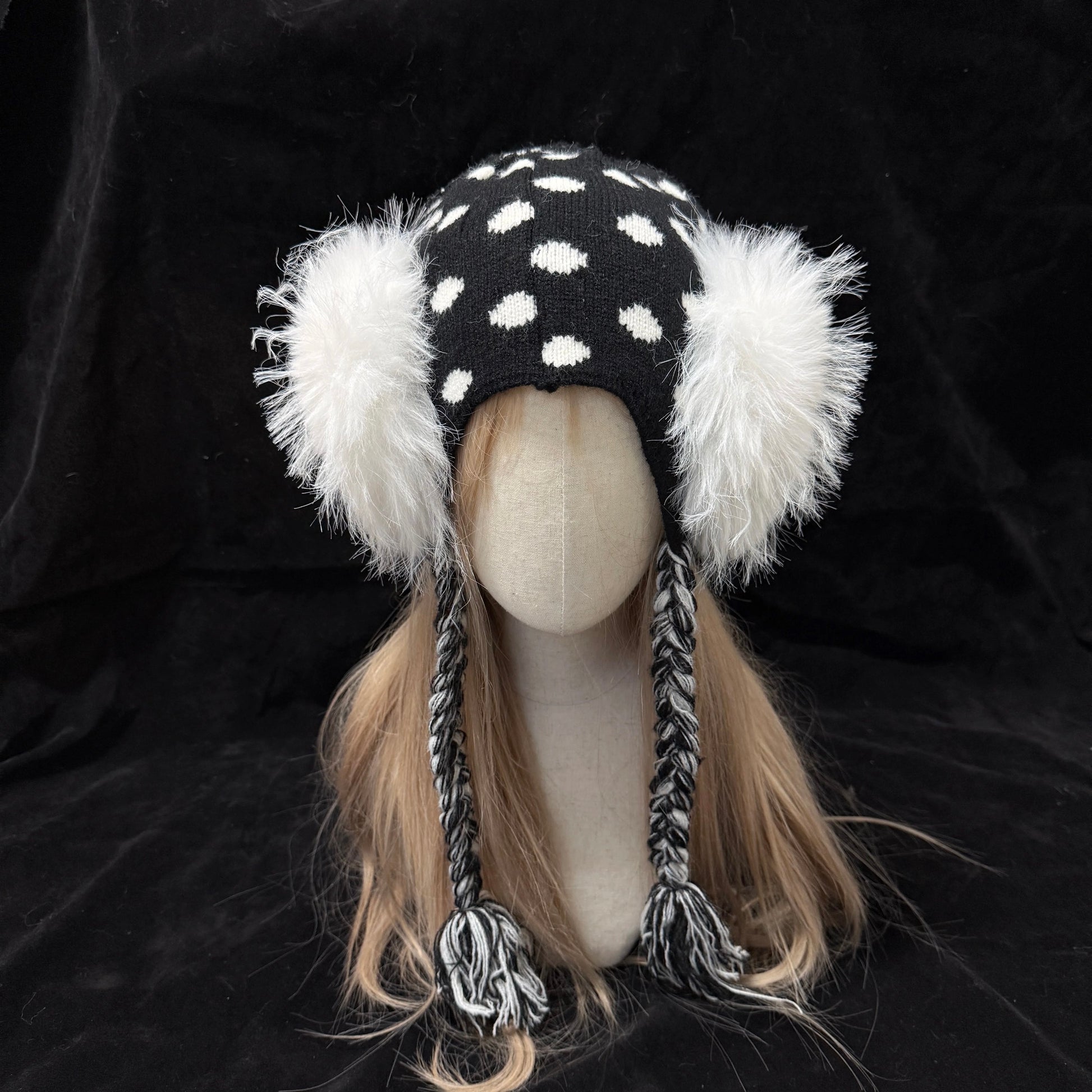 Black and white polka dot knit earflap hat with big white fur pom poms y2k aesthetic