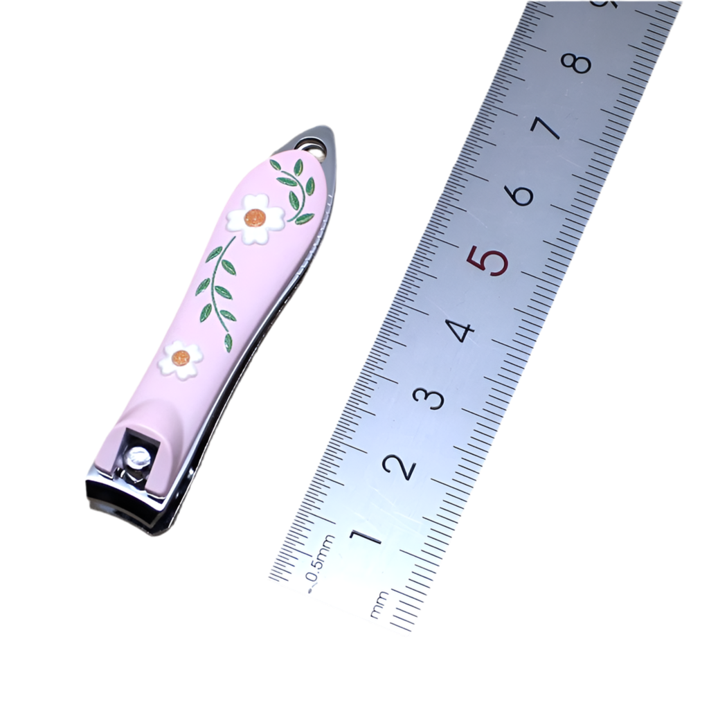 Light pink nail clipper with a floral design, featuring white flowers and green leaves on the surface.