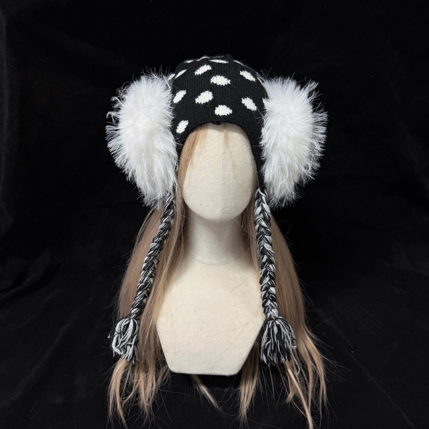 Black and white polka dot knit earflap hat with big white fur pom poms y2k aesthetic