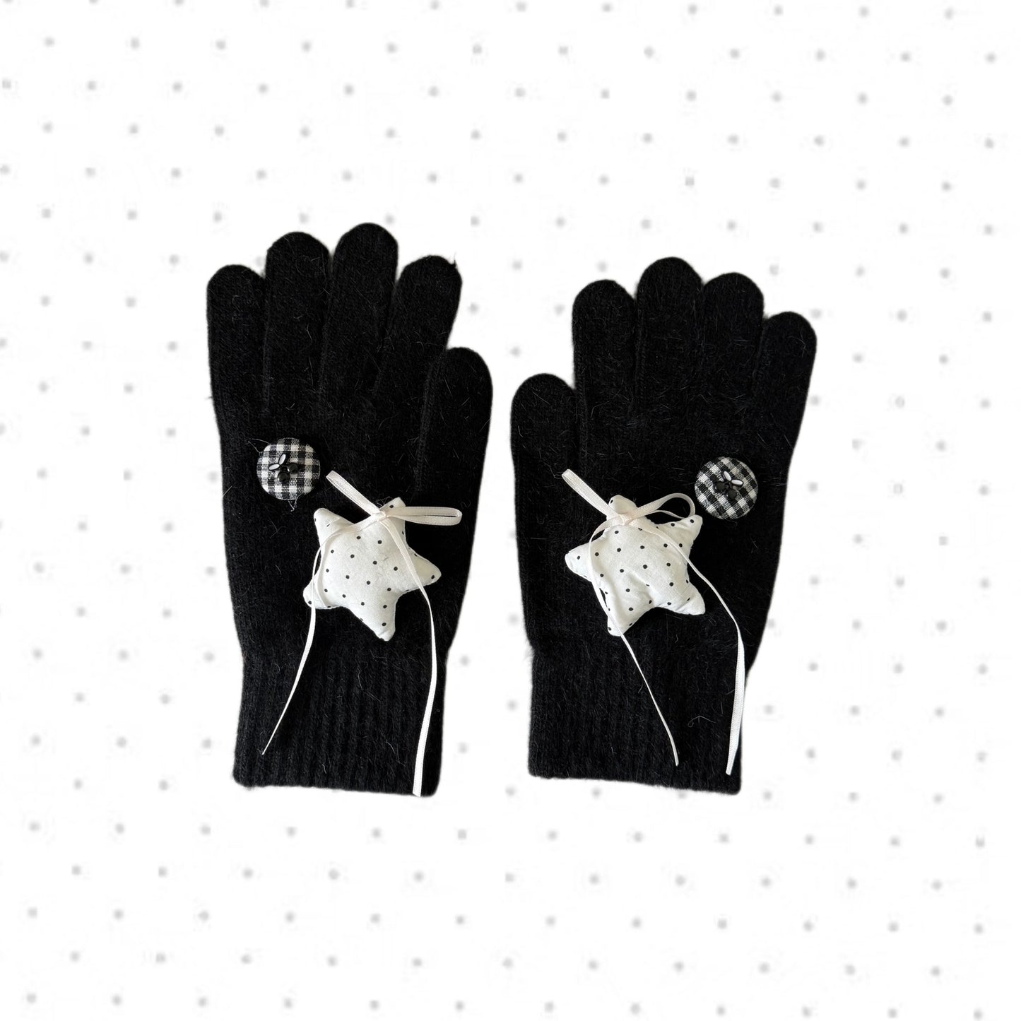 Black knit gloves with white stars and ribbon bows for Y2K grunge aesthetic.