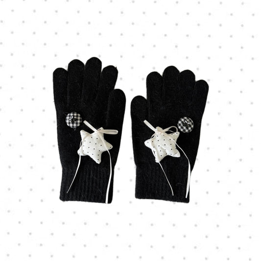 Black knit gloves with white stars and ribbon bows for Y2K grunge aesthetic.