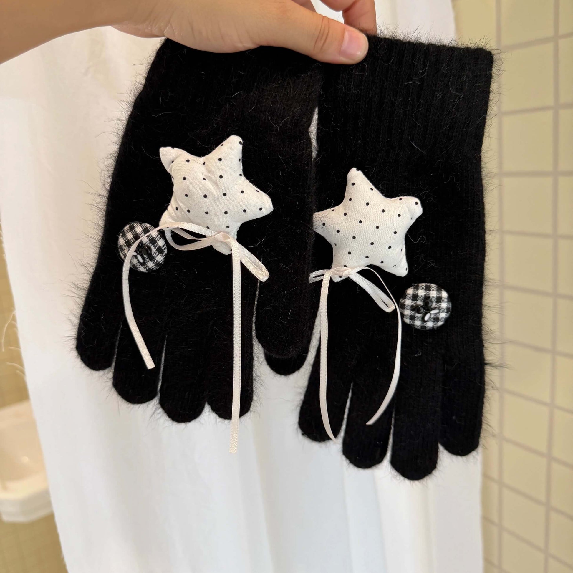 Black knit gloves with white stars and ribbon bows for Y2K grunge 