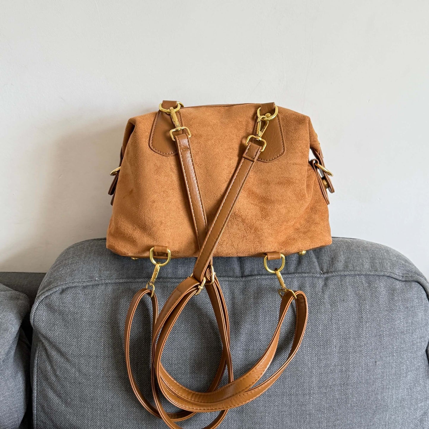Kawaii brown faux suede backpack with 3D plushie bear, donut, and bunnies.