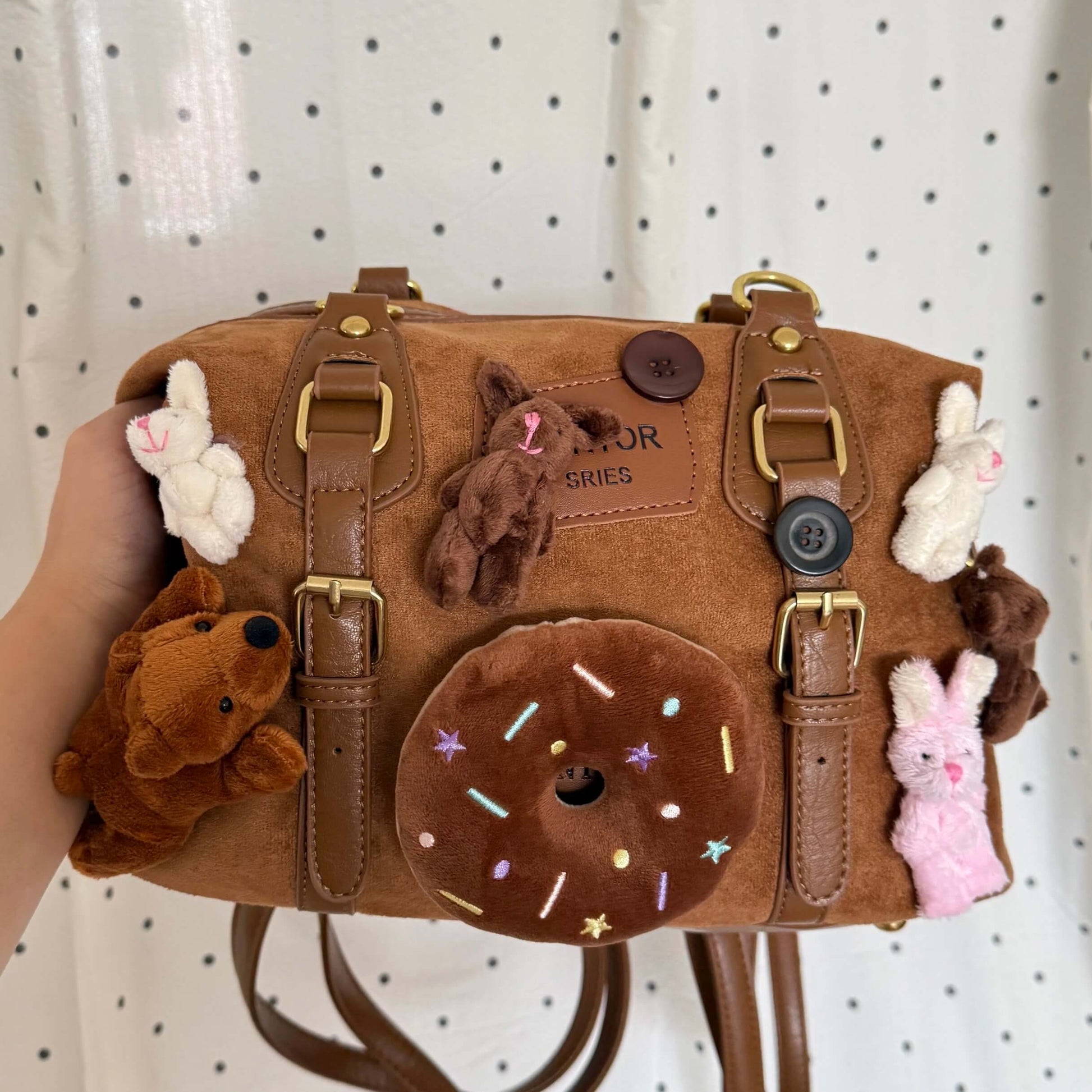 Kawaii brown faux suede backpack with 3D plushie bear, donut, and bunnies.