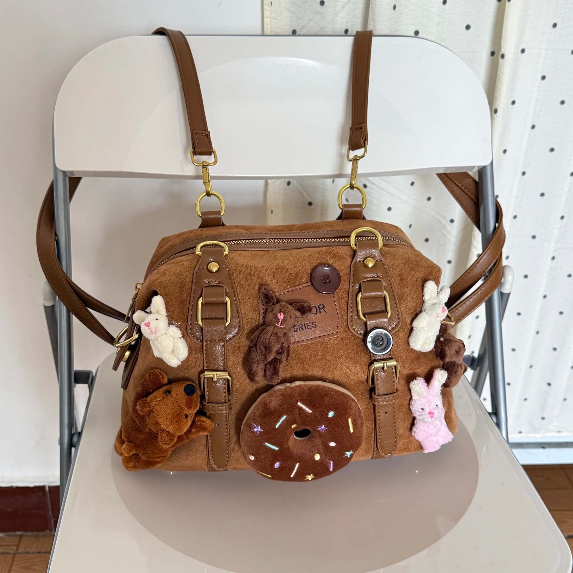 Kawaii brown faux suede backpack with 3D plushie bear, donut, and bunnies.