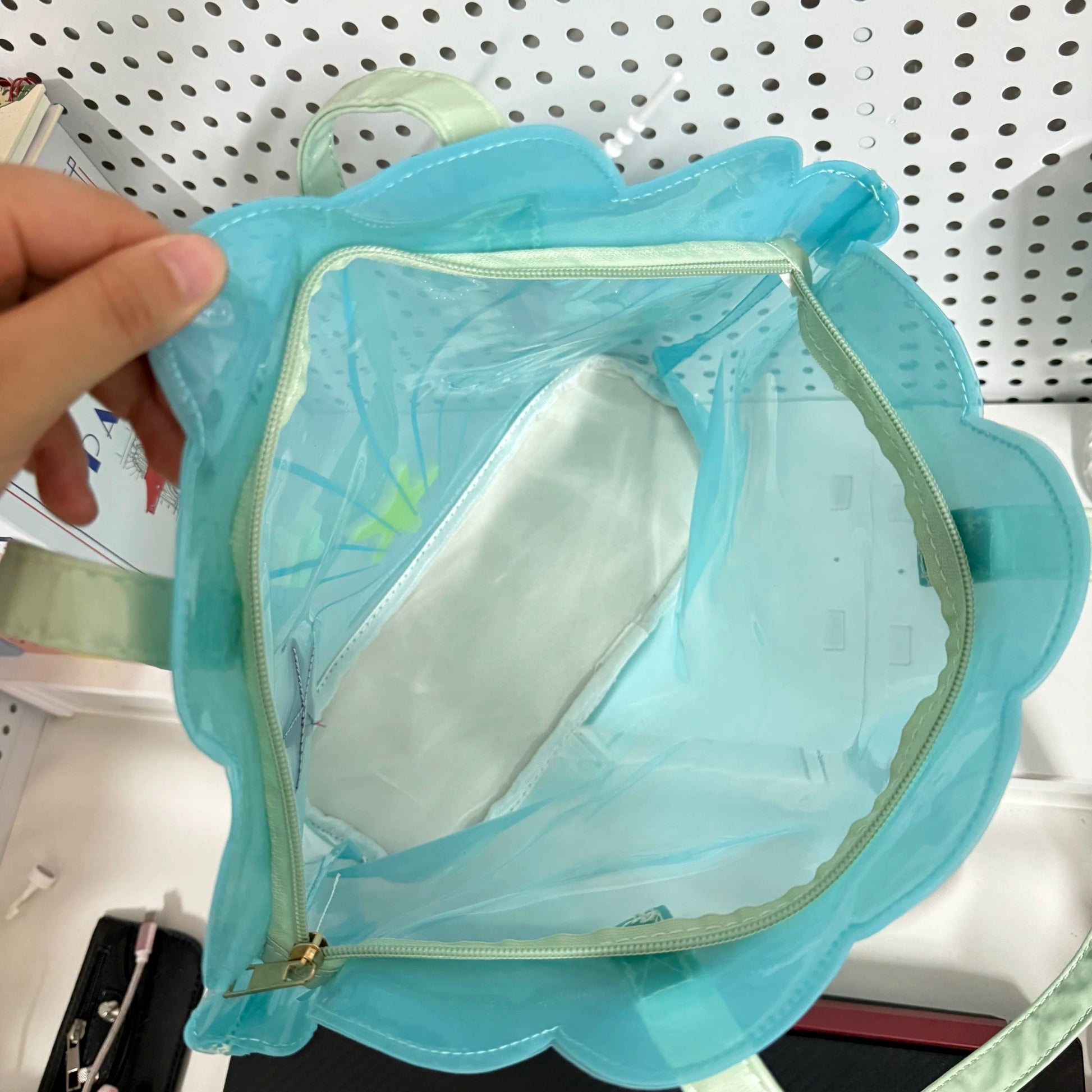 Clear aqua blue shell-shaped jelly tote bag with 3D starfish, seashells, and pearl ribbon charm.